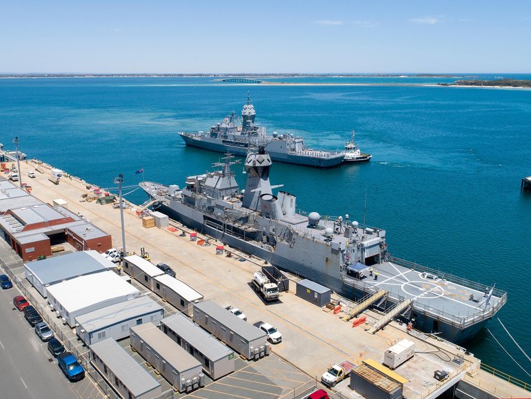 HMAS Perth moves into position in front of HMAS Ballarat.