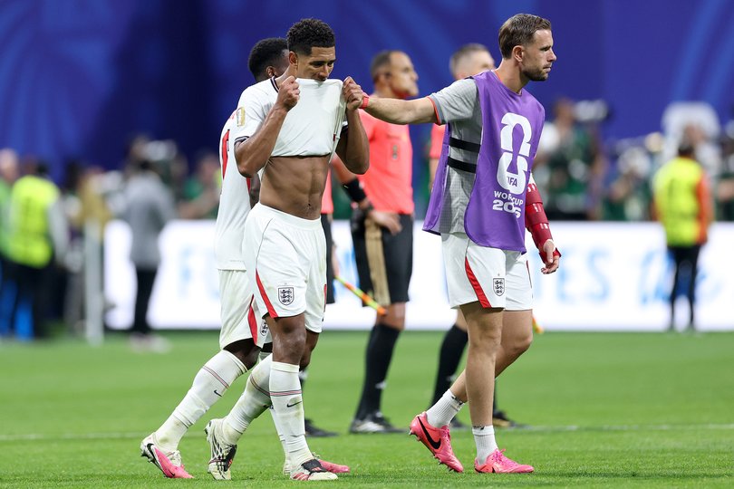 Jude Bellingham is consoled by Marc Guehi and Jordan Henderson after England’s loss.