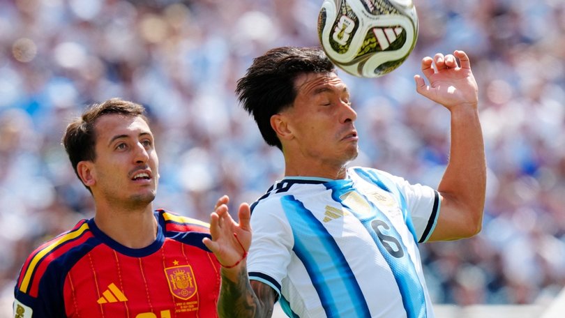 Mikel Oyarzabal watches as Argentina’s Lisandro Martinez heads the ball.