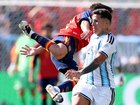 Enzo Fernandez of Argentina fouls Pau Cubarsi.