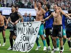 Argentina players celebrated their win over England with a Falkland Islands banner.