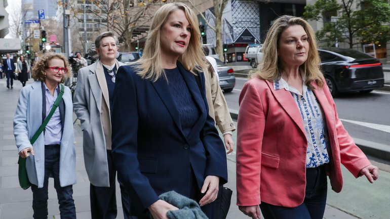 ANU professor Joan Leach, second from left, and professor Rebekah Brown, centre, arrive for the Royal Commission into anti-Semitism and Social Cohesion in Melbourne. 