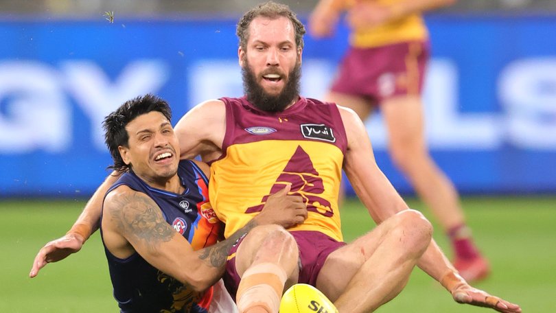 Eagle Tim Kelly tackles Lion Darcy Fort.