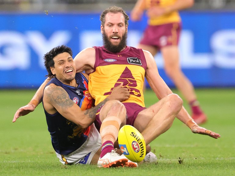 Eagle Tim Kelly tackles Lion Darcy Fort.