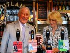 King Charles says it might be "a good day to drown a few sorrows". 