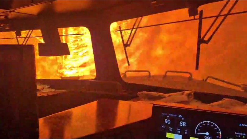 Video captured on 13 July shows a wildfire surrounding a freight train in Ontario, Canada.