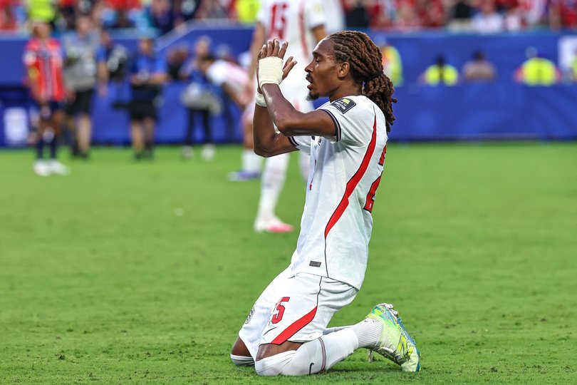 Djed Spence  of England is seen praying at the end of the FIFA World Cup 26 Quarter-Final.