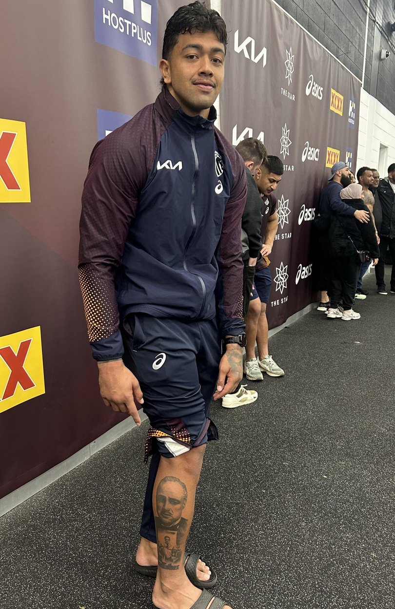 Xavier Willison shows off his Godfather tattoo in the Broncos sheds. Picture: Martin Gabor