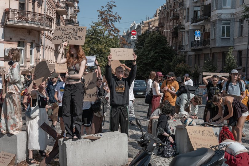 Demonstrators gather to protest the dismissal of the country’s defence minister, Mykhailo Fedorov.