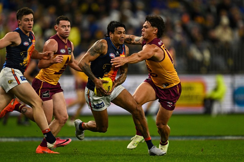PERTH, AUSTRALIA - JULY 18: Tim Kelly of the Eagles is tackled by Cam Rayner of the Lions during the 2026 AFL Round 19 match between the West Coast Eagles and the Brisbane Lions at Optus Stadium on July 18, 2026 in Perth, Australia. (Photo by Daniel Carson/AFL Photos)
