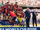 US President Donald Trump and FIFA President Gianni Infantino stand on stage as Rodri #9 of Spain raises the FIFA World Cup Winner’s Trophy.