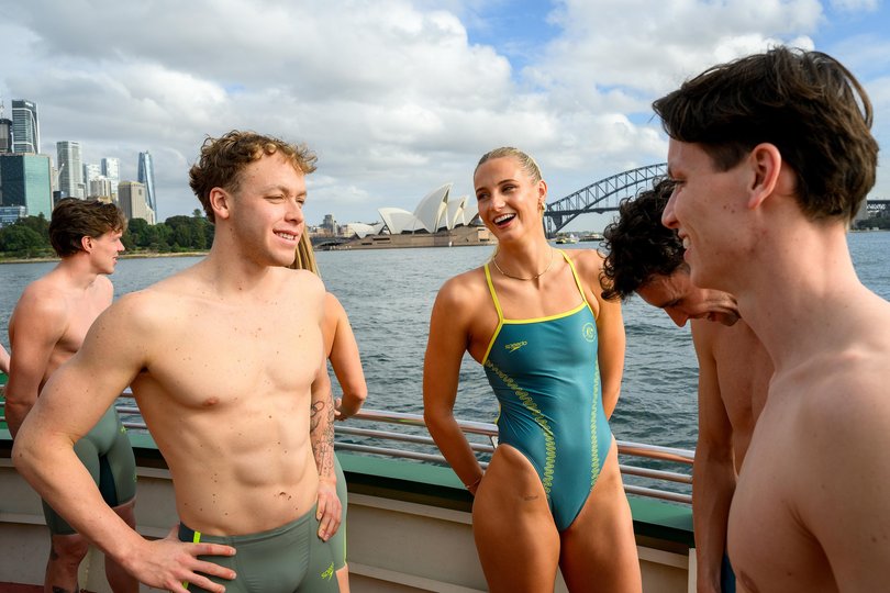 Sam Short (left), and Hannah Casey (centre) during the unveiling of the Australian Dolphins Swimming Team uniforms for the Glasgow 2026 Commonwealth Games.