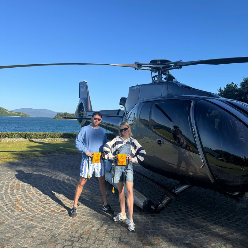 Sydney Sweeney and Scooter Braun before a helicopter ride.