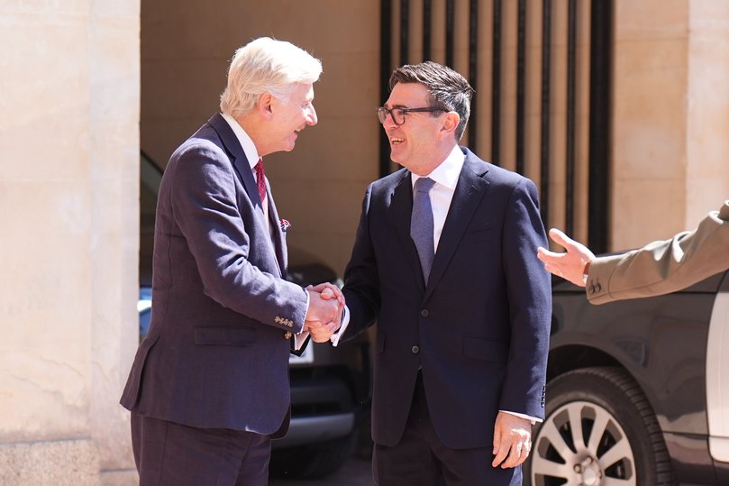 LONDON, ENGLAND - JULY 20: Sir Clive Alderton (left), Principal Private Secretary to the King greets Labour Party leader Andy Burnham as he arrives at Buckingham Palace, on July 20, 2026 in London, England. The Member of Parliament for Makerfield becomes the UK's 59th Prime Minister, succeeding Sir Keir Starmer, who resigned as leader of the Labour Party and Prime Minister in June. (Photo by Aaron Chown - Pool/Getty Images)