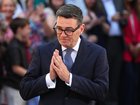 The new British Prime Minister and leader of the Labour Party, Andy Burnham, gestures as he speaks to the media as he arrives at 10 Downing Street.