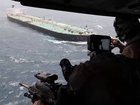 Image released by US Central Command to with the caption 'Every operational success in the Middle East begins and ends with service members focused on their missions, including the U.S. blockade against Iran. As of July 21, U.S. forces have redirected 8 commercial vessels and disabled 1 to fully enforce the blockade.' 