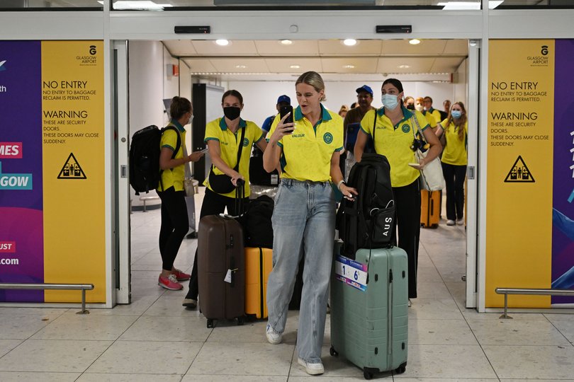 Shayna Jack, centre, of the Australian Dolphins Swim Team arrives at Glasgow International Airport ahead of the Commonwealth Games.