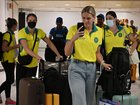 Shayna Jack, centre, arrives at at Glasgow International Airport ahead of the Commonwealth Games in Glasgow.