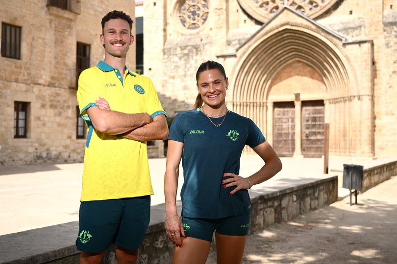 Kurtis Marschall of Australia, left, and Nina Kennedy of Australia get set for the track and field at Glasgow.