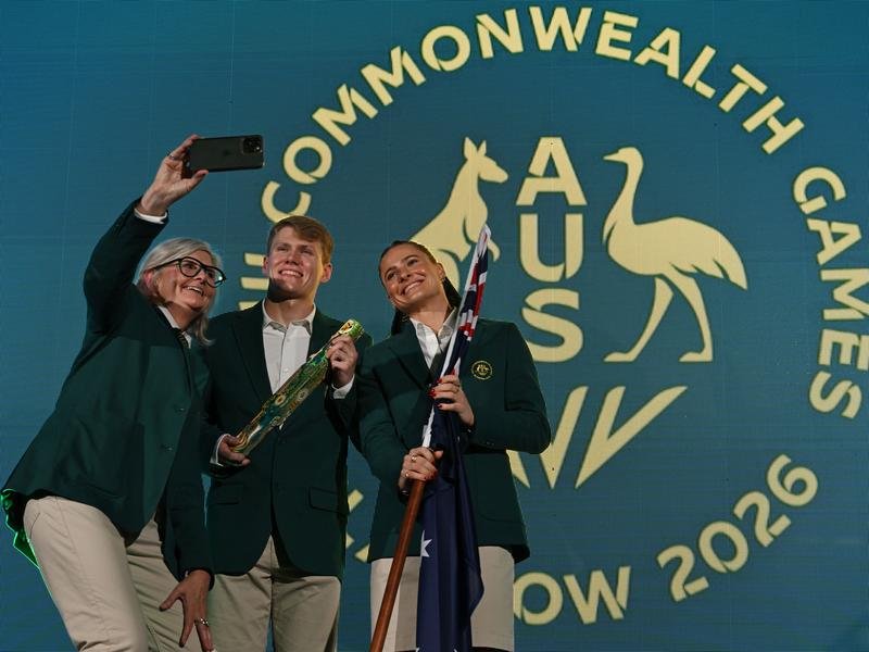 Governor-General Sam Mostyn takes a selfie with Tim Hodge and Nina Kennedy. (Dean Lewins/AAP PHOTOS)