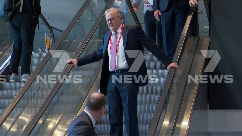 Prime Minister Anthony Albanese stumbles on the escalator at the 50th Australian Labor Party (ALP) national convention at the Adelaide Convention Centre, in Adelaide