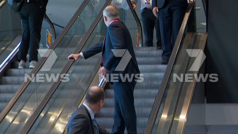 Prime Minister Anthony Albanese stumbles on the escalator at the 50th Australian Labor Party (ALP) national convention at the Adelaide Convention Centre, in Adelaide