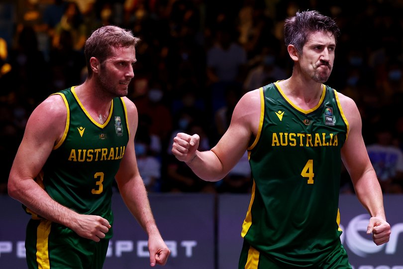 Greg Hire #4 and Jesse Wagstaff #3 of Australia celebrate a play against New Zealand.
