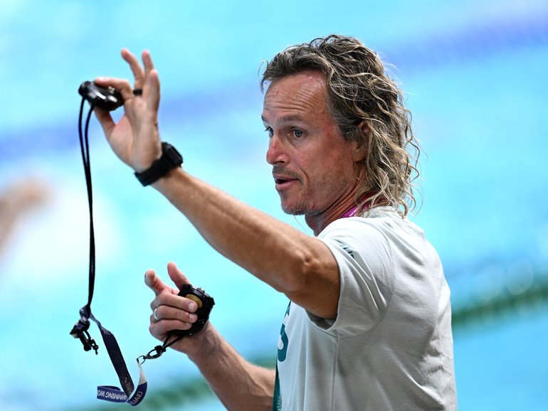 Dean Boxall, Team Australia Swimming Coach, puts the team through a hit out ahead of the Games.