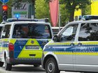 A knife-wielding 20-year-old who fatally attacked a man and appeared to hold others hostage in a bank in the southern German city of Regensburg has been detained, local media and police say.
