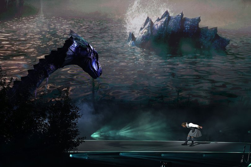 Nessie is revealed as Sam Heughan performs during the opening ceremony.