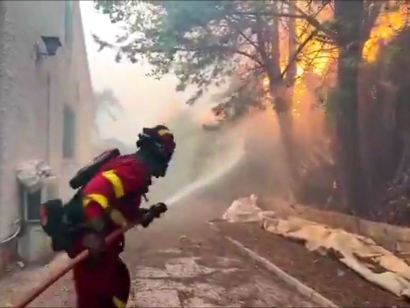 A firefighter battles flames in San Martín de Valdeiglesias, near Madrid.