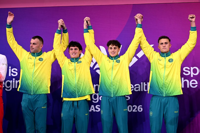 Gold medalists Flynn Southam, Kai Taylor, Harrison Turner and Kyle Chalmers of Team Australia celebrate during the medal ceremony for the Men's 4 x 100m Freestyle Relay Final.