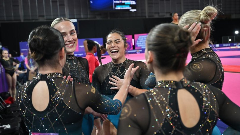 Georgia Godwin (centre) has led Australia to a gold medal in the Artistic Gymnastics Women's Teams. (Lukas Coch/AAP PHOTOS)