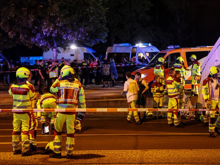 One person has been killed and dozens more injured after a car was driven into a crowd of people gathered at a pride parade in Berlin on Saturday night, authorities say.
