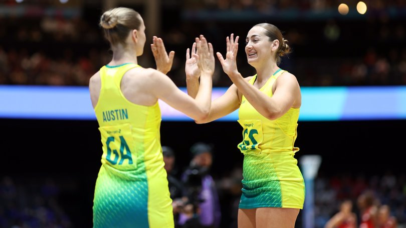 Kiera Austin and Sophie Garbin of Team Australia celebrate during the Netball Preliminary Pool A match between Team Australia and Team England