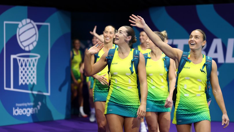 Players of Team Australia wave to the fans prior to the Netball Preliminary Pool A match between Team Australia and Team England.
