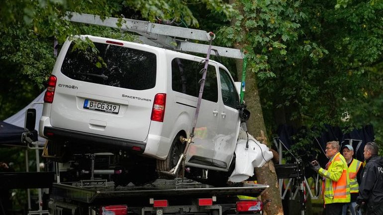 Authorities say an attacker mowed people down with a white mini-van and then stabbed others. (AP PHOTO)