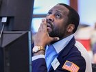 Wall St investors are weighing concerns over AI, the Mideast and tariffs, sending markets lower. (AP PHOTO)