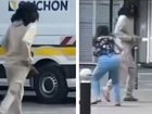 Footage from Paris shows an alleged knifeman appearing to lunge at a woman on the street.