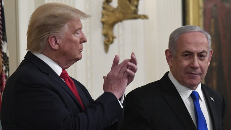 President Donald Trump, left, listens as Israeli Prime Minister Benjamin Netanyahu, right, speaks during an event at the White House in 2020.