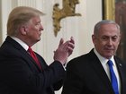 President Donald Trump, left, listens as Israeli Prime Minister Benjamin Netanyahu, right, speaks during an event at the White House in 2020.