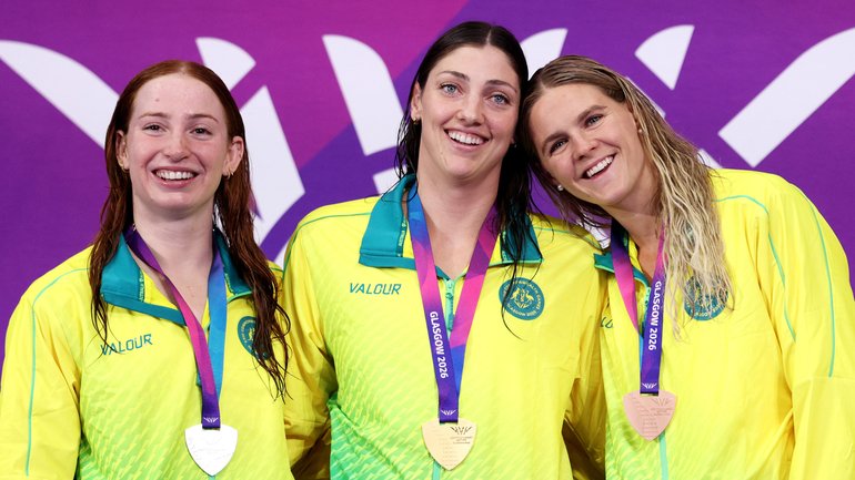 Gold medallist Meg Harris flanked by Mollie O'Callaghan and Shayna Jack during the medal ceremony for the women’s 100m freestyle.