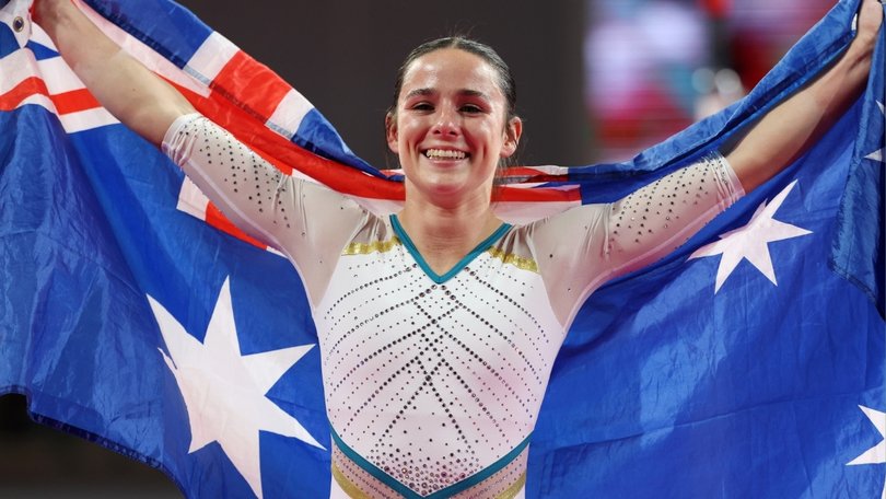Kate McDonald beams after winning gold to earn redemption.