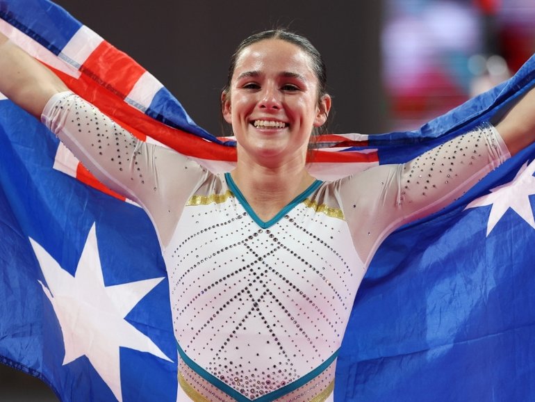 Kate McDonald beams after winning gold to earn redemption.