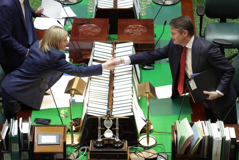 Ben Carroll shakes hands with opposition leader, Jess Wilson,  in his first question time as Premier of Victoria. 