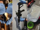 Grenades, guns, drugs and cash have been seized during a raid on an alleged safe house. 