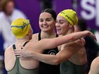 Sienna Toohey, Iona Anderson and Alex Perkins celebrate winning the 4x100m medley relay.