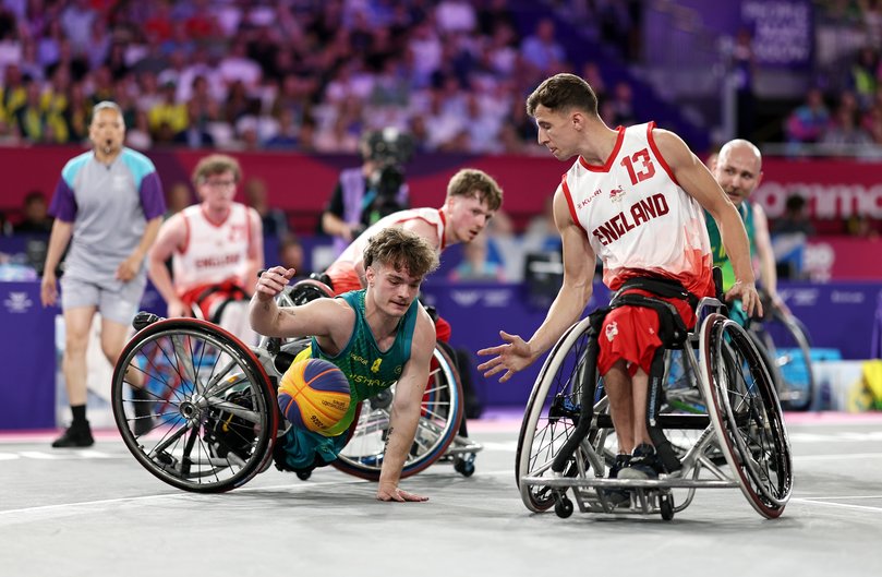 GLASGOW, SCOTLAND - JULY 29: Eithen Leard of Team Australia is challenged by Peter Cusack of Team England during the Wheelchair Men's Gold Medal match between Team Australia and Team England on day six of the Glasgow 2026 Commonwealth Games at SEC Centre on July 29, 2026 in Glasgow, Scotland. (Photo by James Fearn/Getty Images)