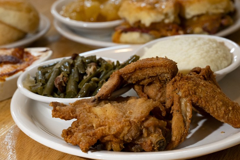 A fried chicken dinner with country vegetables, still prepared as Harland Sanders intended.