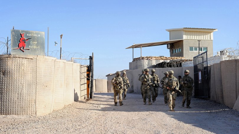 Australian Army soldiers from Special Operations Task Group depart Camp Russell for a mission in Uruzgan with Afghan soldiers.